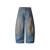 Distressed ripped denim trousers