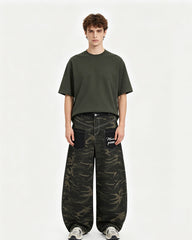 Distressed patchwork camouflage trousers