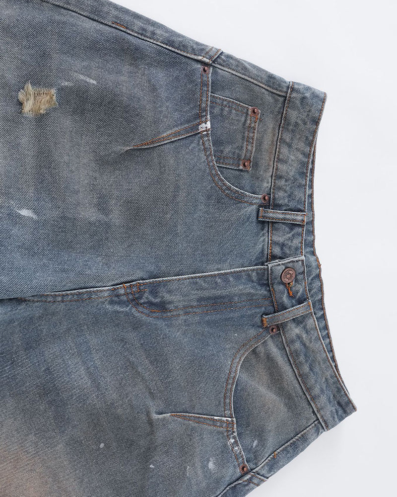 Distressed ripped denim trousers