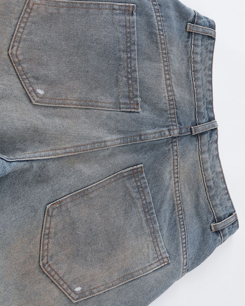 Distressed ripped denim trousers