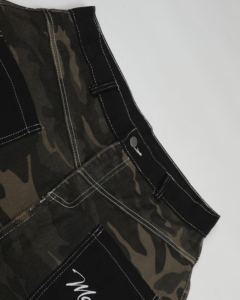 Distressed patchwork camouflage trousers