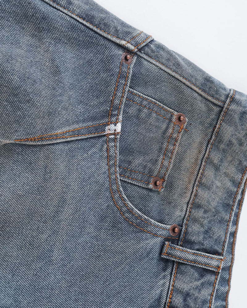 Distressed ripped denim trousers