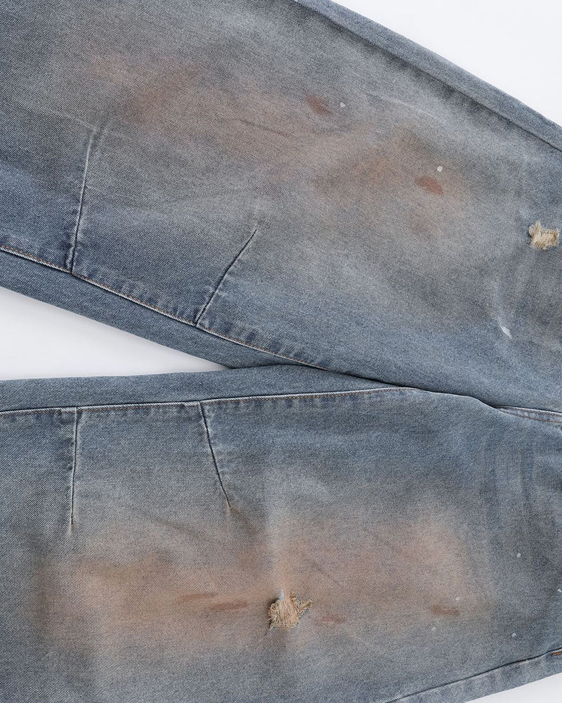 Distressed ripped denim trousers