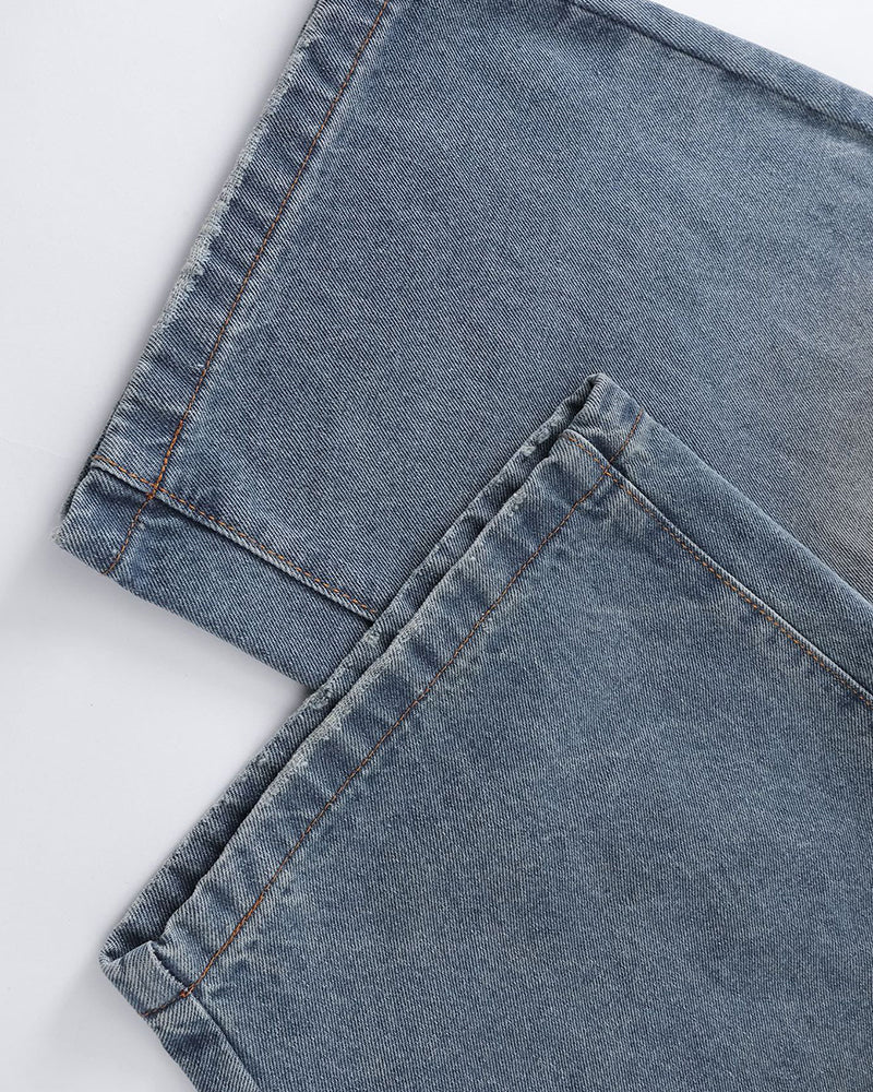 Distressed ripped denim trousers
