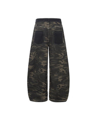 Distressed patchwork camouflage trousers