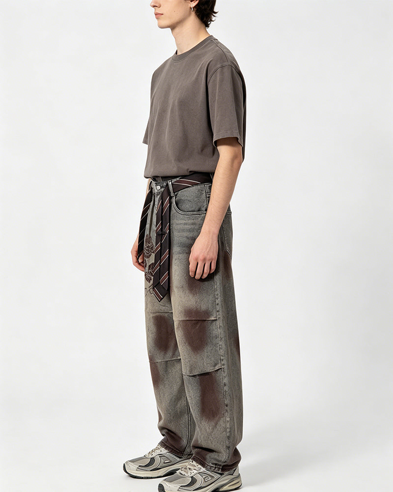 Distressed embroidered jeans